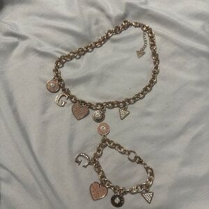 Rose gold GUESS charm bracelet and necklace set